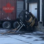 Forklift falls off dock